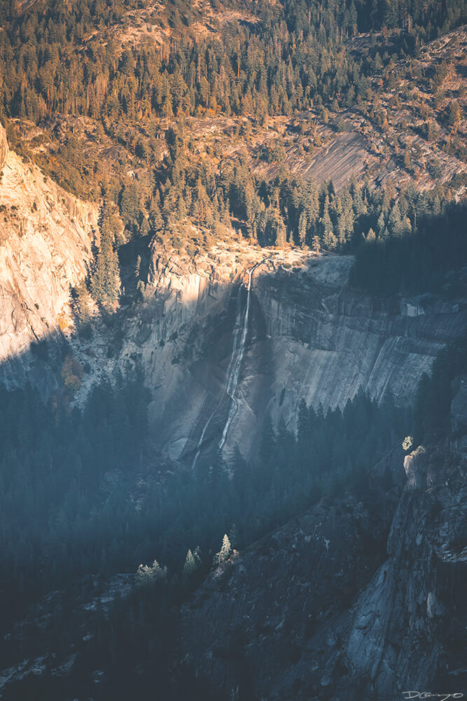 An overhead view of a waterfall from Glacier Point in Yosemite, CA
