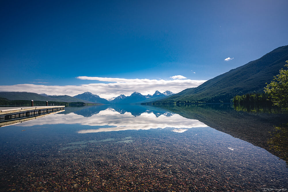 Looking out towards mountains from Lake McDonald in Glacier National Park, Montana