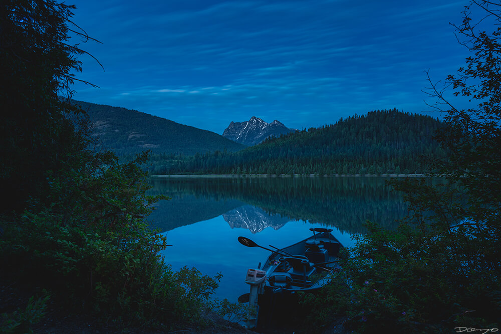 A rowboat on Bad Medicine Lake at blue hour, Montana